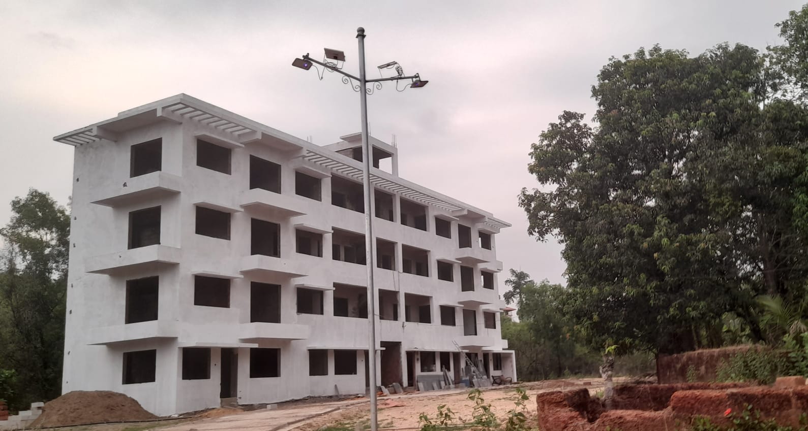 Actual evening site photo of Paradise Homes B Wing at Janavli near Kankavli